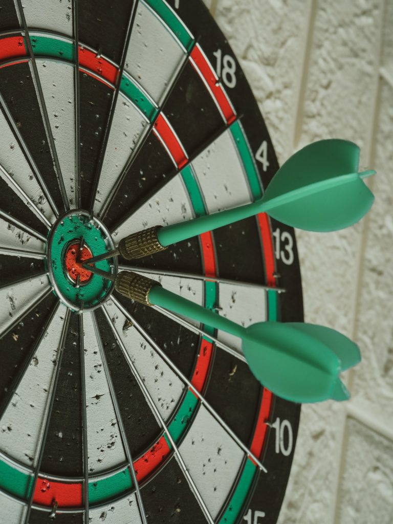 Darts as an example of learning the basics and practicing them enough to get the hang of the skill.