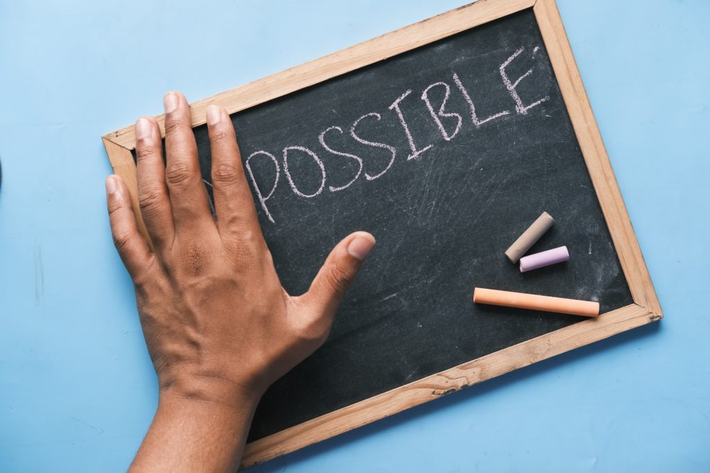 Chalkboard saying "possible". Using strategic thinking to improve your health.